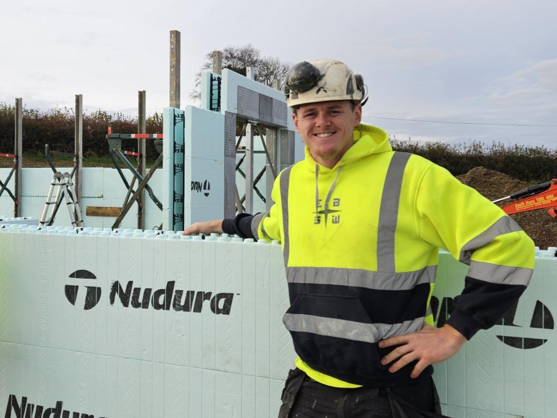 man in construction with hard hat and yellow vis