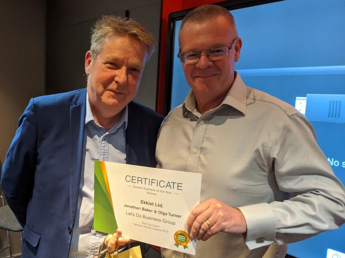 Anthony Turner presenting a certificate to Ekkist Ltd