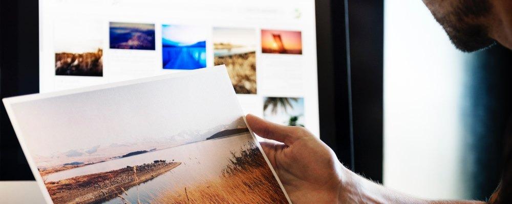 A photographer reviewing their portfolio on a website