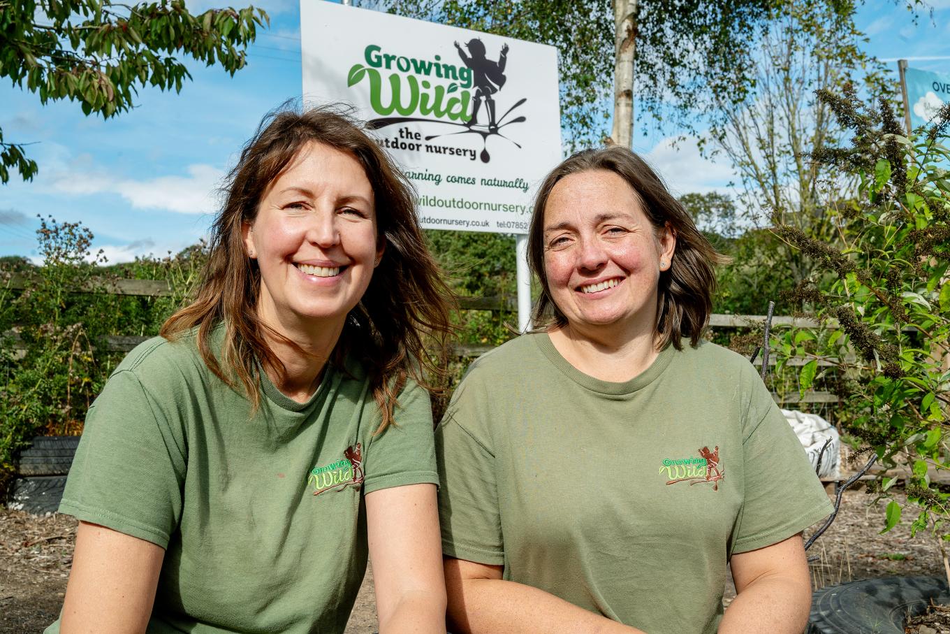 Founders of Growing Wild outside their business